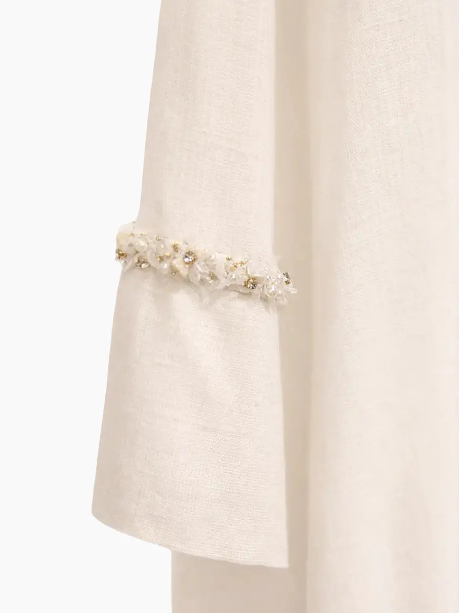 Capa em linho misto, com acabamento artesanal